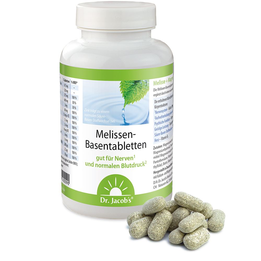 Dr. Jacob’s Melissen-Basentabletten in einer weißen Plastikflasche mit grünem Etikett, dazu mehrere ovale, gesprenkelte Tabletten, die vor dem Behälter auf weißem Hintergrund platziert sind.
